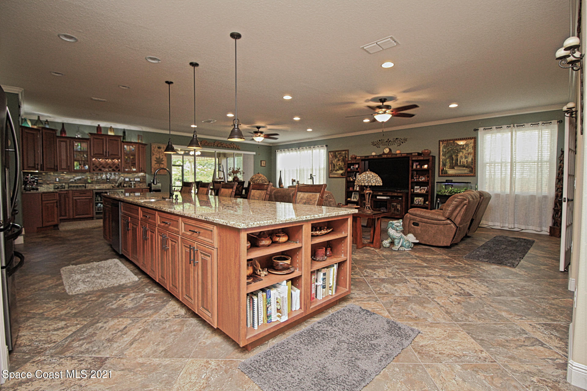 4034 Preservation Circle Melbourne, FL 32934 - Photo 11 of 25 a kitchen with stainless steel appliances lots of counter top space