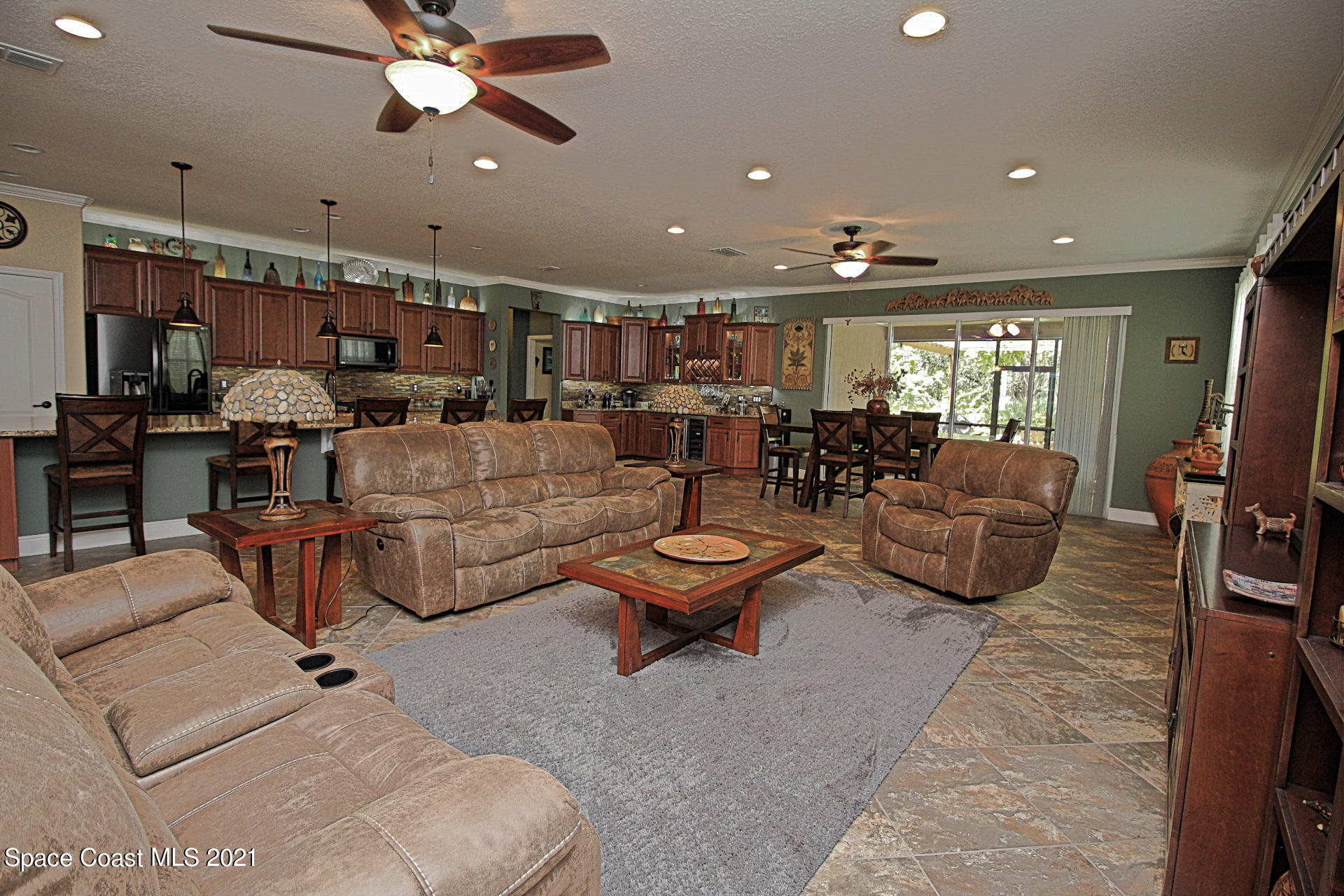 4034 Preservation Circle Melbourne, FL 32934 - Photo 12 of 25 a living room with furniture and a large window