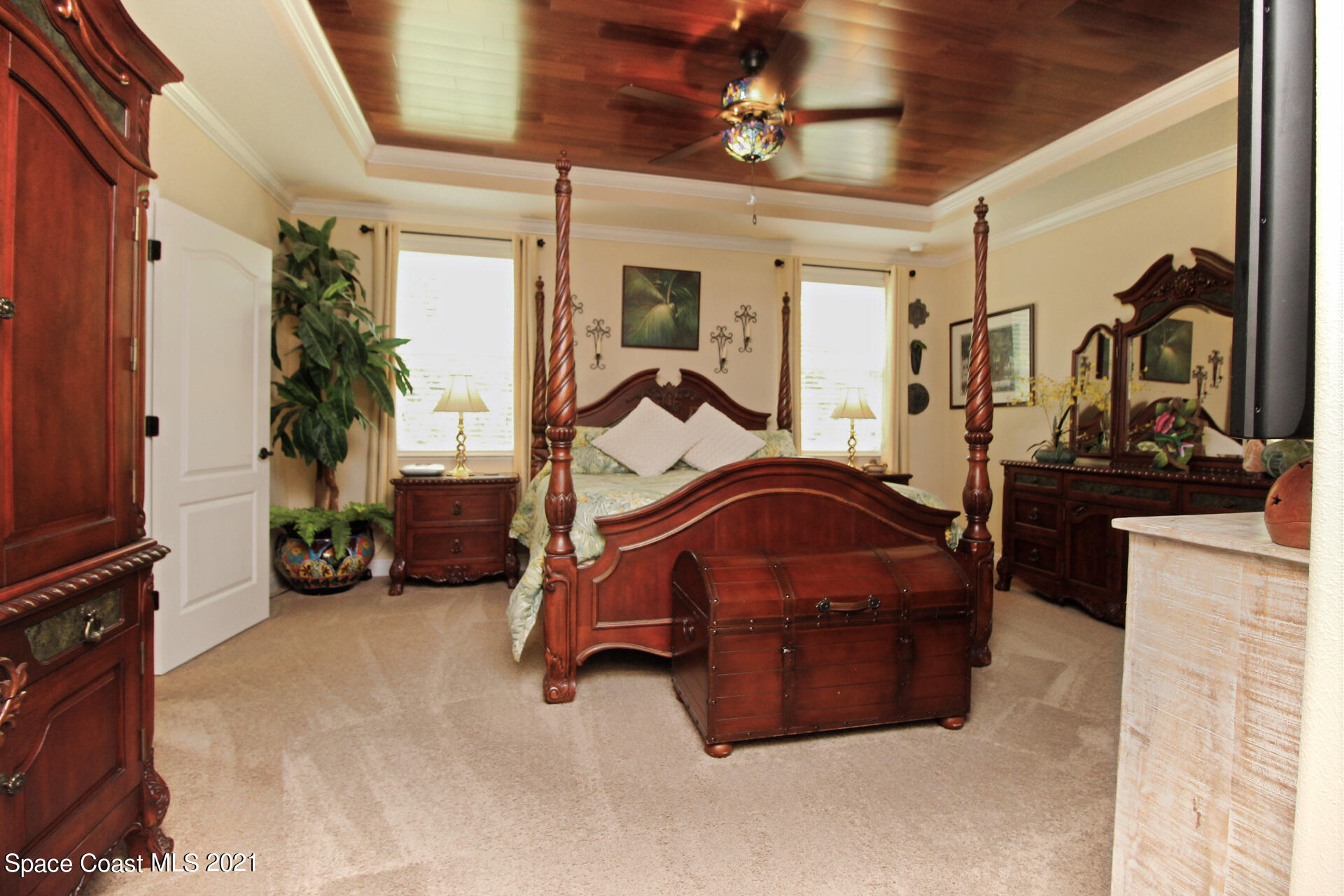 4034 Preservation Circle Melbourne, FL 32934 - Photo 14 of 25 a room with gym equipment and a mirror