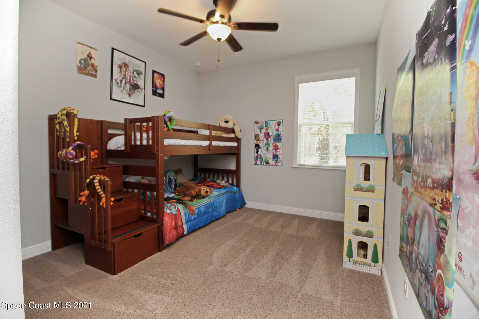 4034 Preservation Circle Melbourne, FL 32934 - Photo 18 of 25 a bed room with a bed and a chair