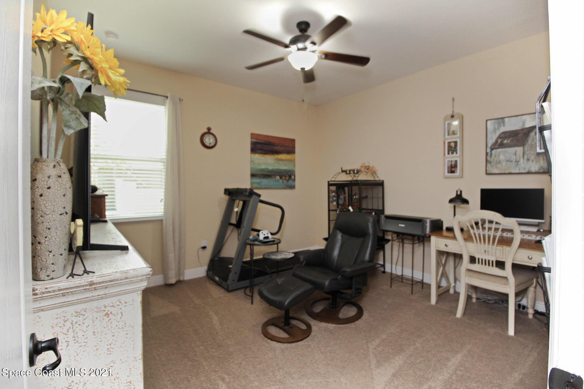 4034 Preservation Circle Melbourne, FL 32934 - Photo 19 of 25 a view of a workspace with furniture and a window