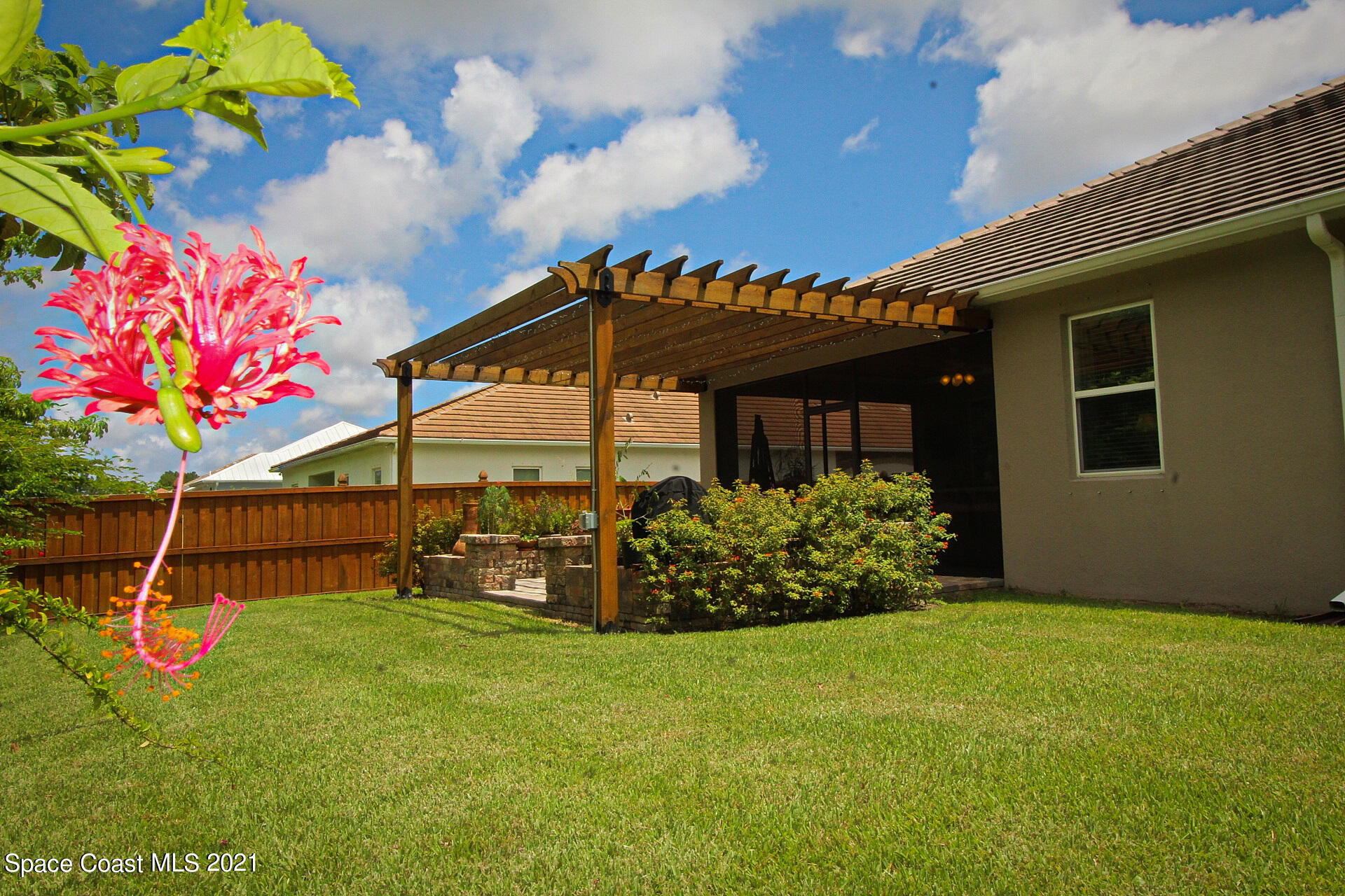 4034 Preservation Circle Melbourne, FL 32934 - Photo 5 of 25 a front view of a house with garden