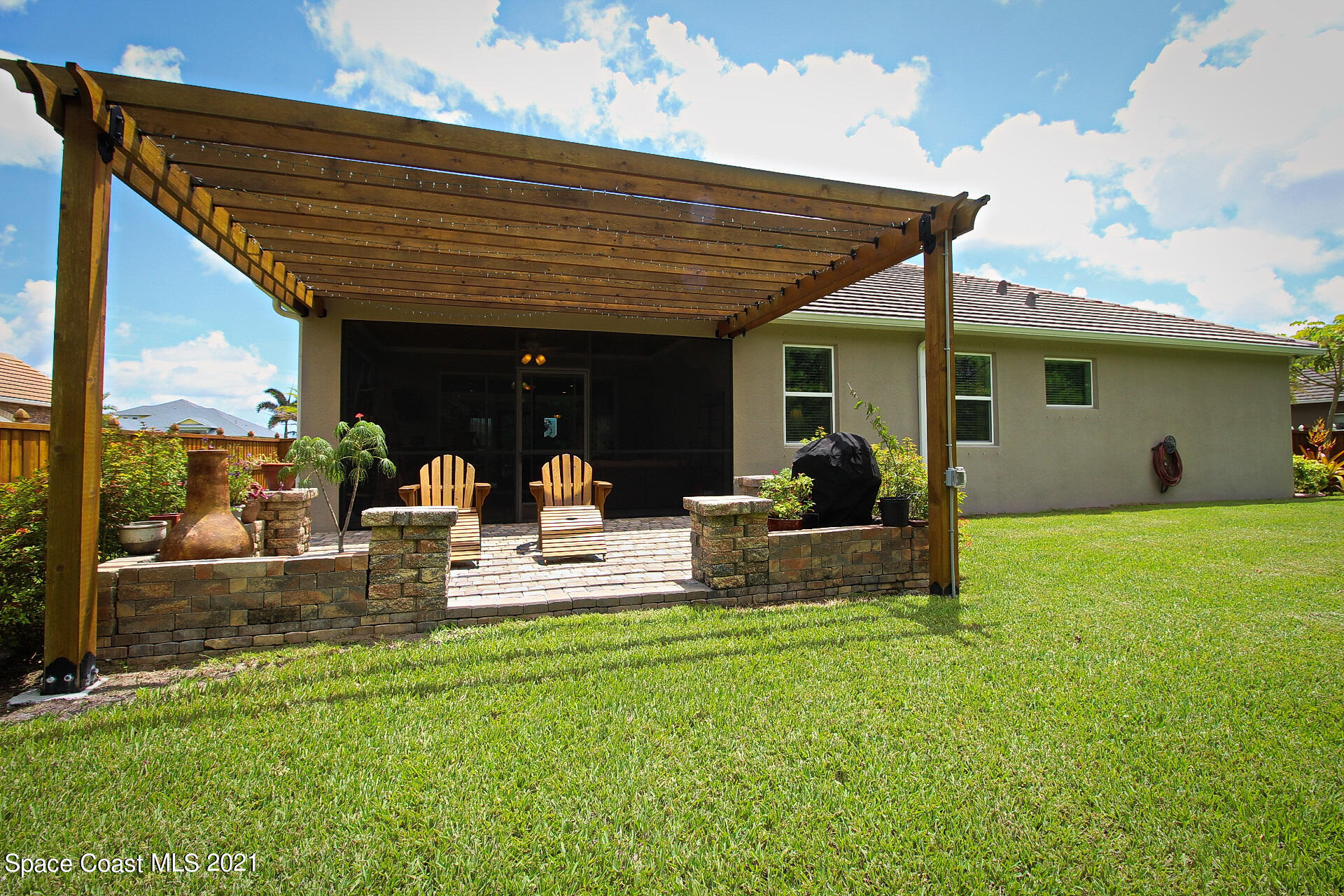 4034 Preservation Circle Melbourne, FL 32934 - Photo 6 of 25 a view of a backyard with a patio