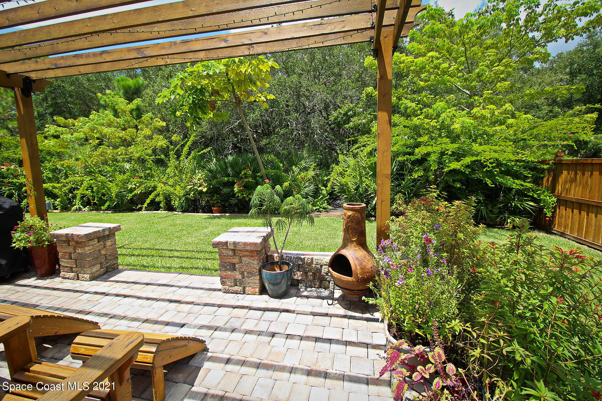 4034 Preservation Circle Melbourne, FL 32934 - Photo 7 of 25 a view of backyard with seating area and green space