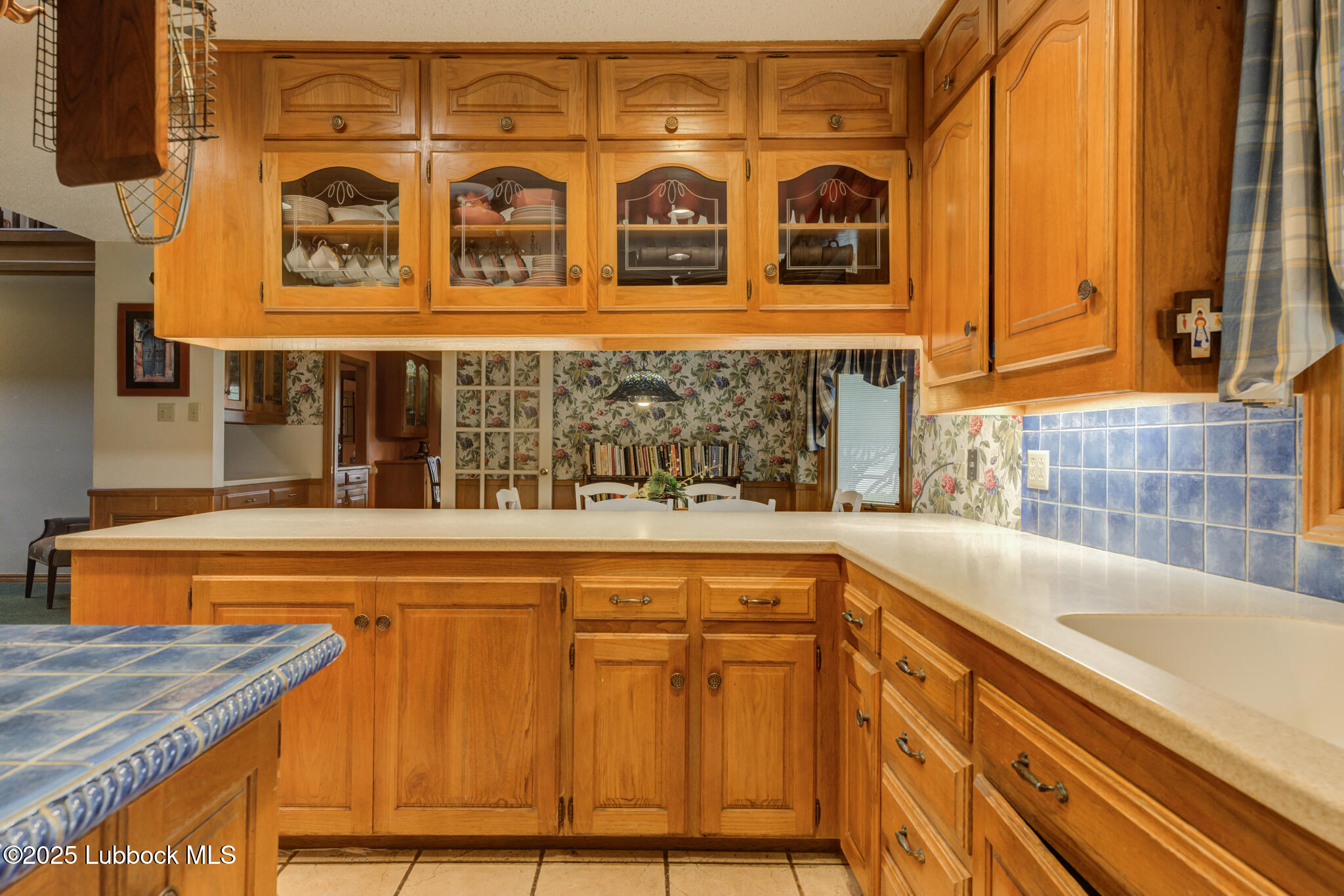 4206 89th Street Lubbock, TX 79423 - Photo 13 of 50 a view of a sink and dishwasher with a large window