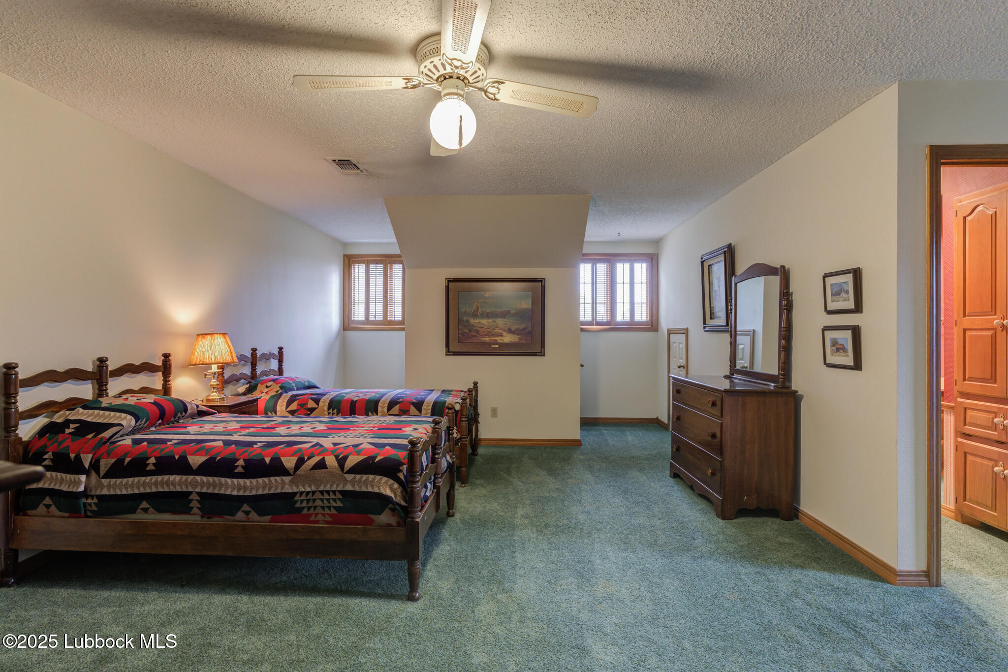 4206 89th Street Lubbock, TX 79423 - Photo 29 of 50 a bedroom with bed and window