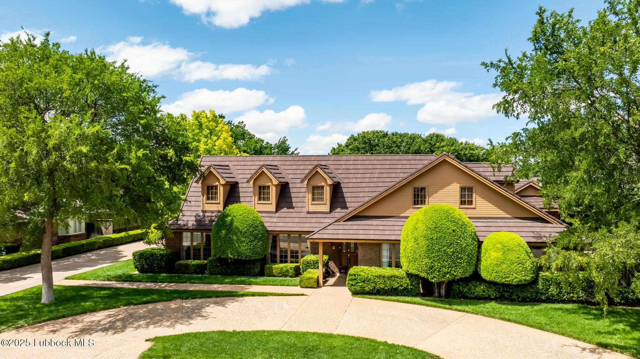 4206 89th Street Lubbock, TX 79423 - Photo 3 of 50 a front view of a house with garden