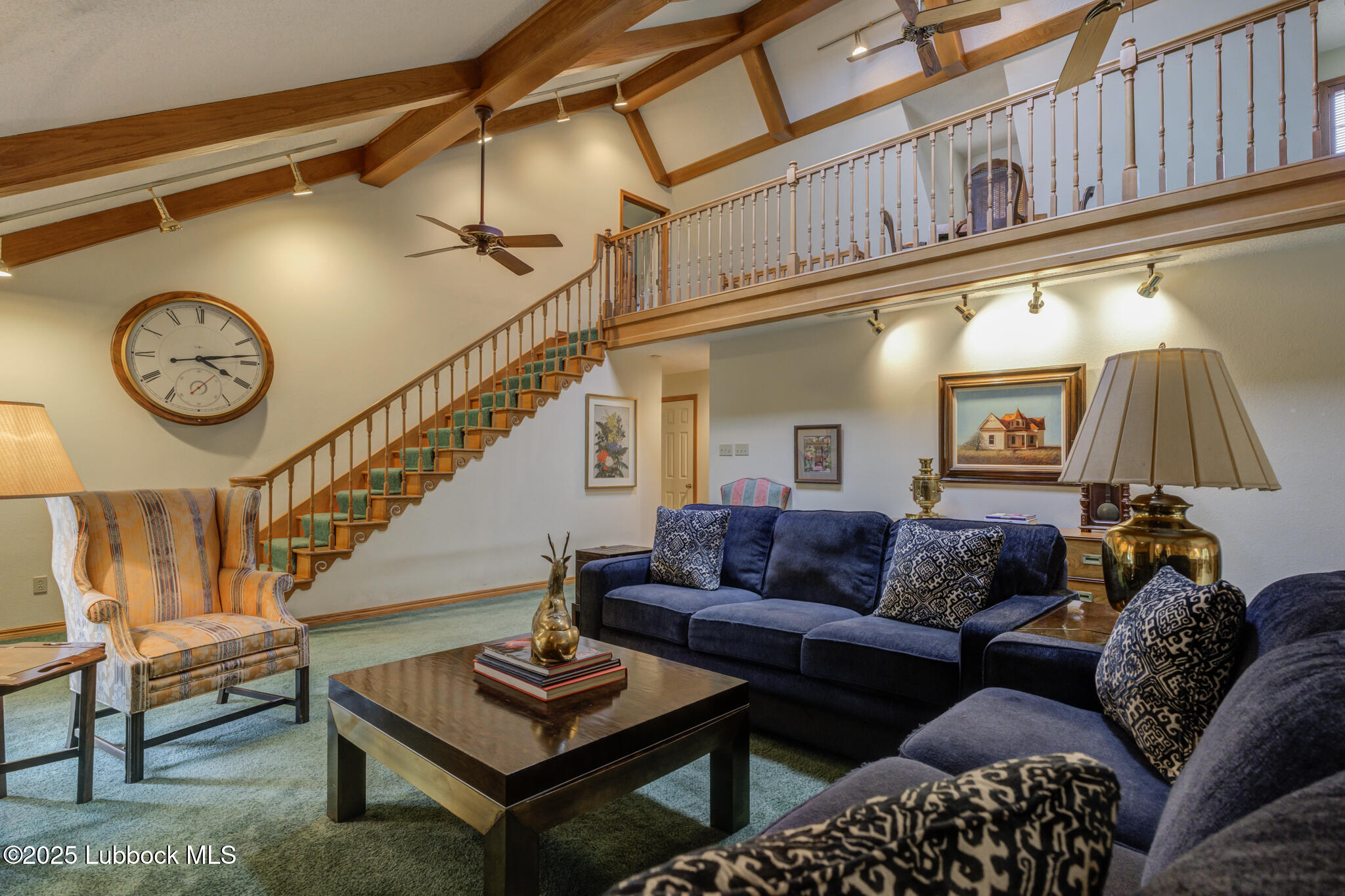 4206 89th Street Lubbock, TX 79423 - Photo 5 of 50 a living room with furniture a clock and a table