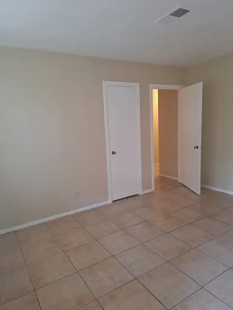 a view of an empty room and window