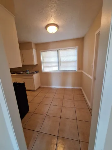 a view of a kitchen with windows