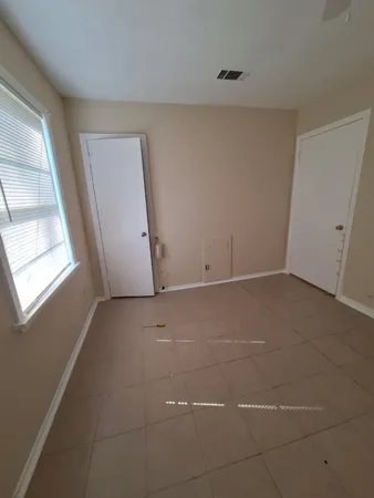 a view of a room that has a window