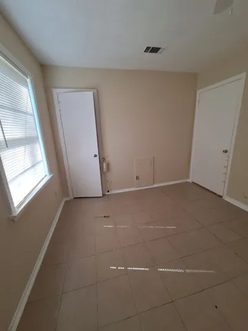 a view of a room that has a window