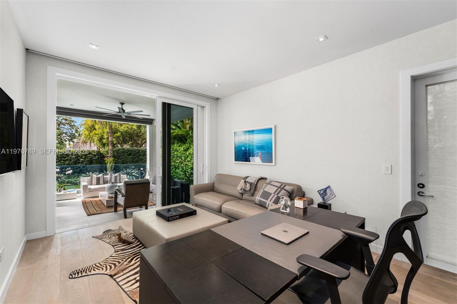 741 Harbor Drive Key Biscayne, FL 33149 - Photo 12 of 36 a living room with furniture and a large window