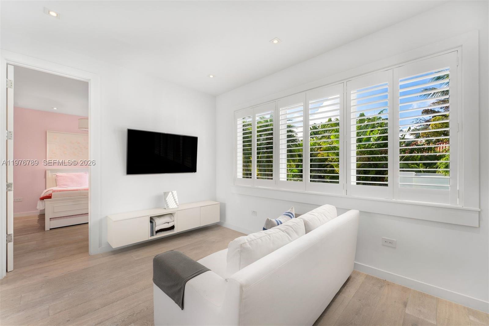 741 Harbor Drive Key Biscayne, FL 33149 - Photo 13 of 36 a living room with furniture and a flat screen tv