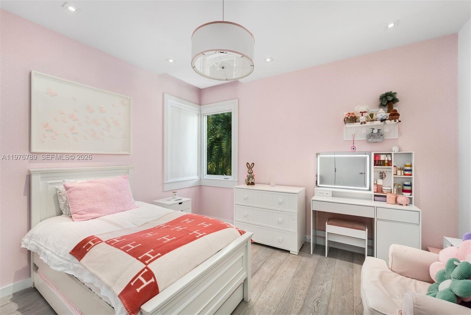 741 Harbor Drive Key Biscayne, FL 33149 - Photo 14 of 36 a bedroom with a bed and a chandelier