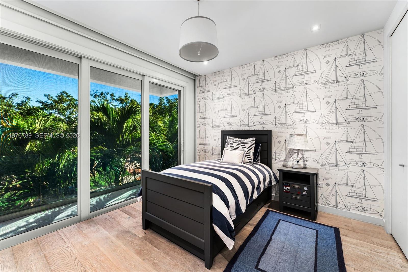 741 Harbor Drive Key Biscayne, FL 33149 - Photo 15 of 36 a bedroom with a bed lamp and window