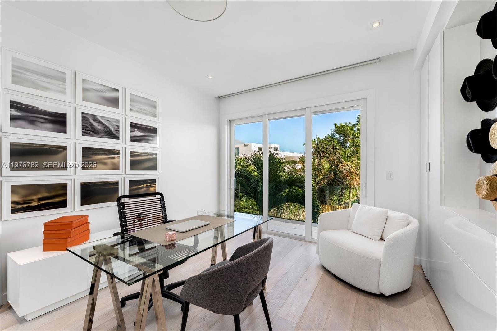 741 Harbor Drive Key Biscayne, FL 33149 - Photo 16 of 36 a living room with furniture and a floor to ceiling window