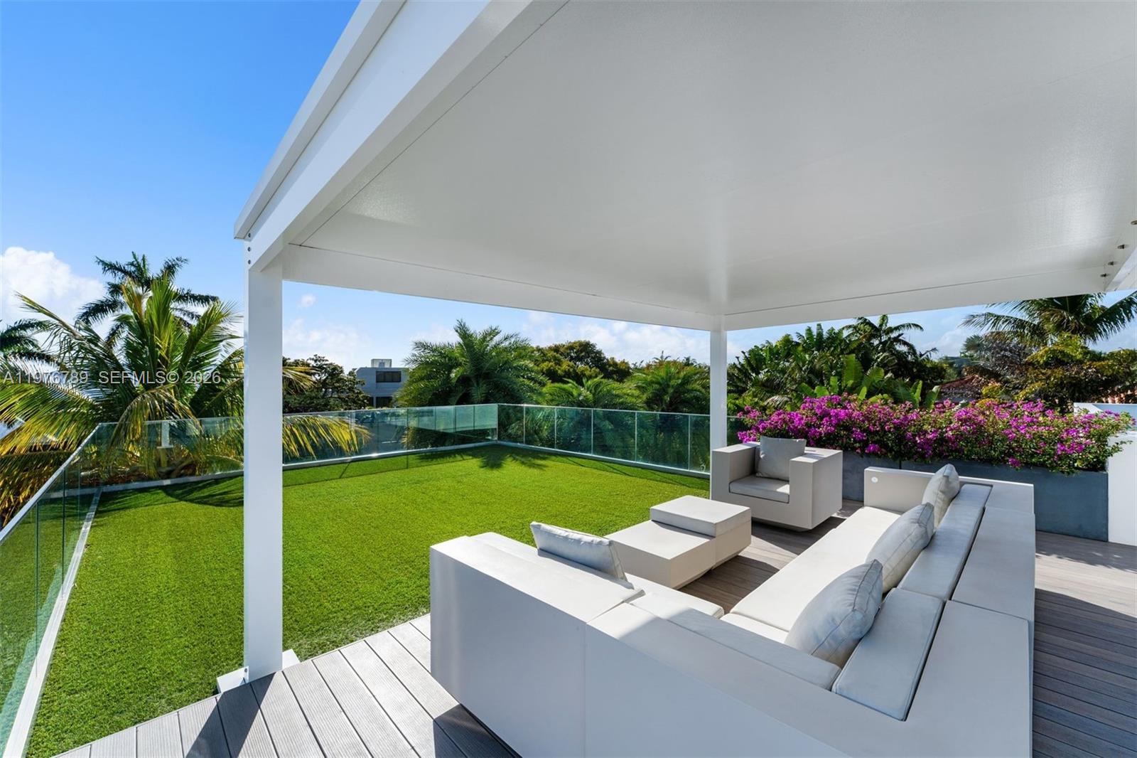 741 Harbor Drive Key Biscayne, FL 33149 - Photo 17 of 36 a view of yard with patio and garden