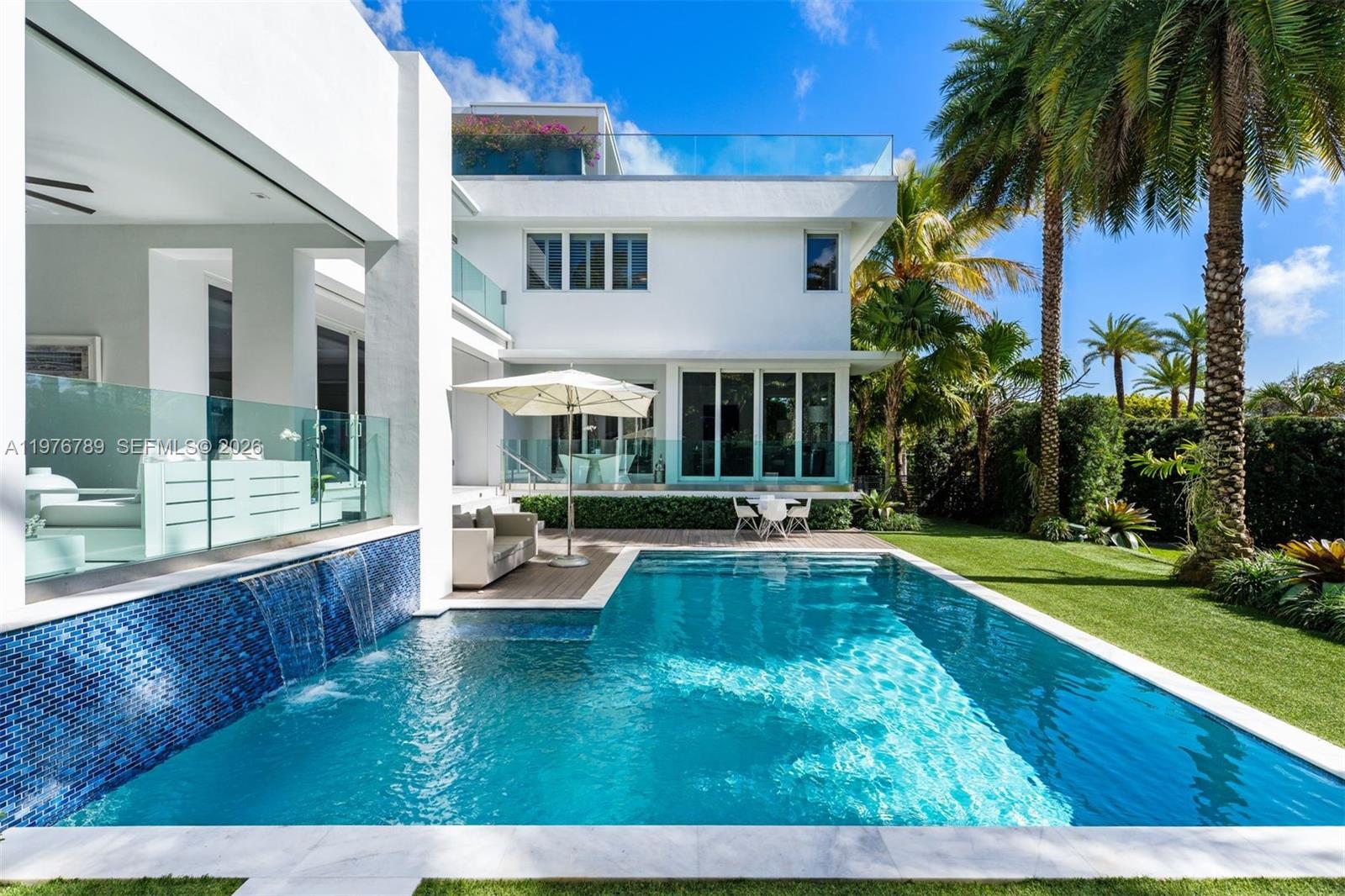 741 Harbor Drive Key Biscayne, FL 33149 - Photo 20 of 36 a view of swimming pool with lawn chairs and plants