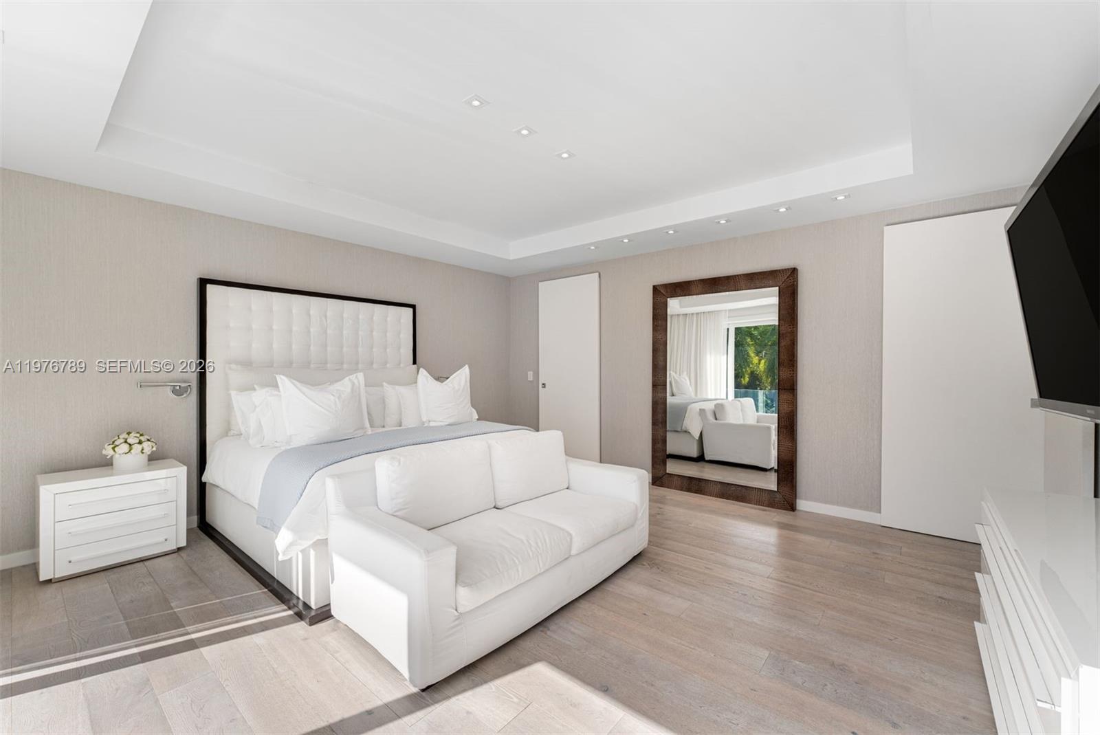 741 Harbor Drive Key Biscayne, FL 33149 - Photo 28 of 36 a bedroom with bed and a flat screen tv