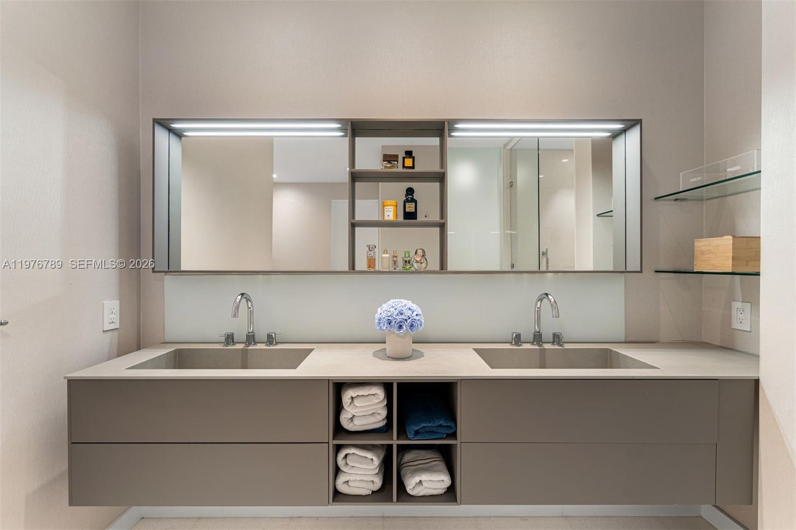 741 Harbor Drive Key Biscayne, FL 33149 - Photo 29 of 36 a bathroom with a sink and a mirror