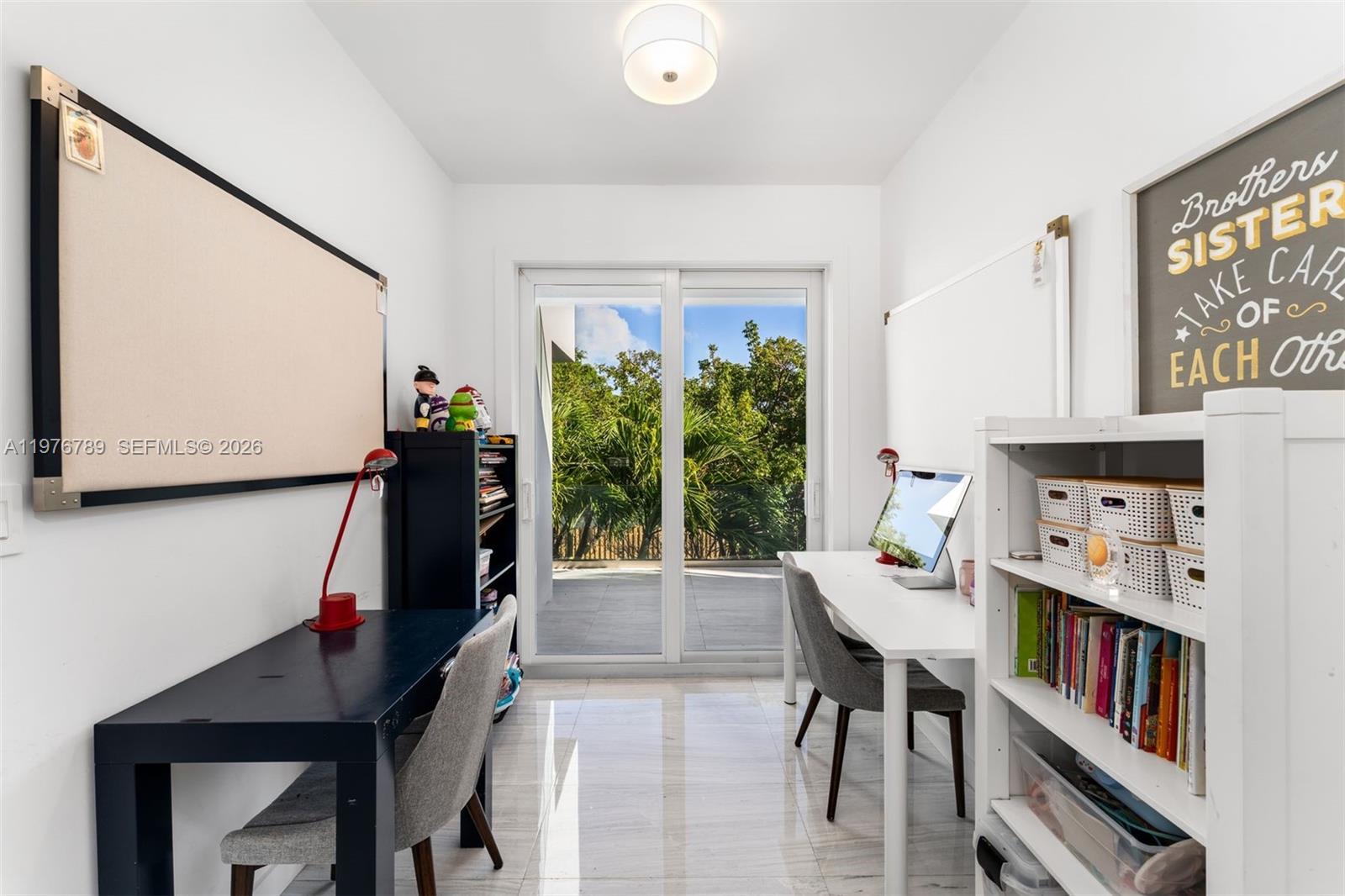 741 Harbor Drive Key Biscayne, FL 33149 - Photo 30 of 36 a living room with furniture and a flat screen tv