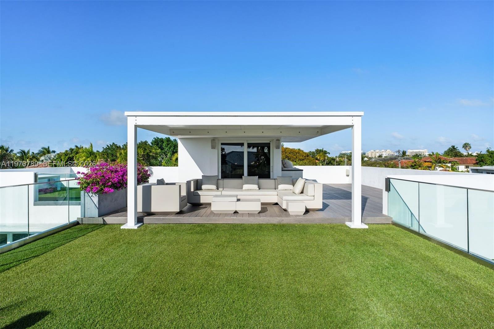 741 Harbor Drive Key Biscayne, FL 33149 - Photo 31 of 36 a view of a house with backyard and sitting area