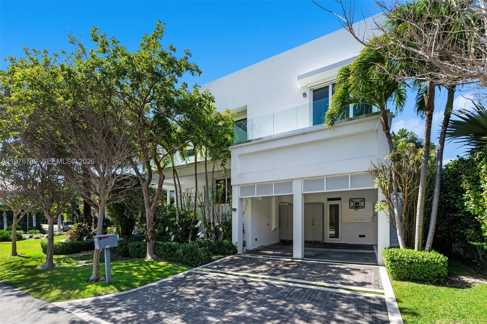 741 Harbor Drive Key Biscayne, FL 33149 - Photo 35 of 36 front view of a house with a yard