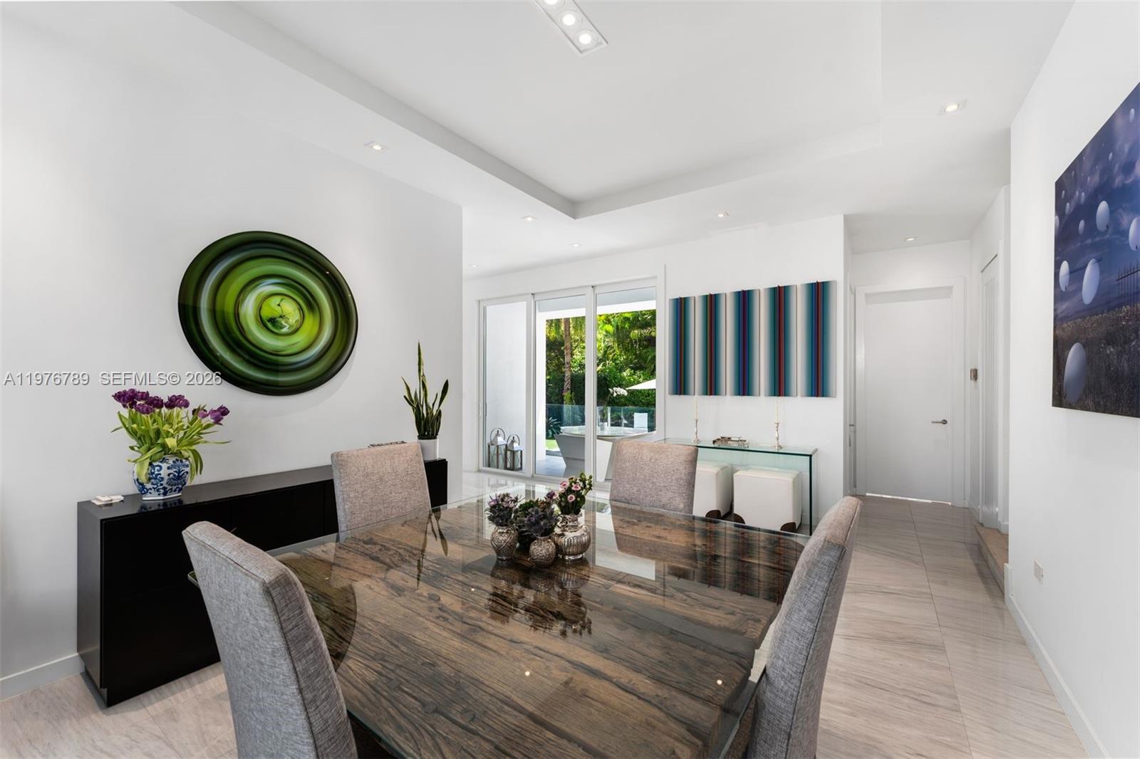 741 Harbor Drive Key Biscayne, FL 33149 - Photo 5 of 36 a view of a dining room with furniture window and wooden floor