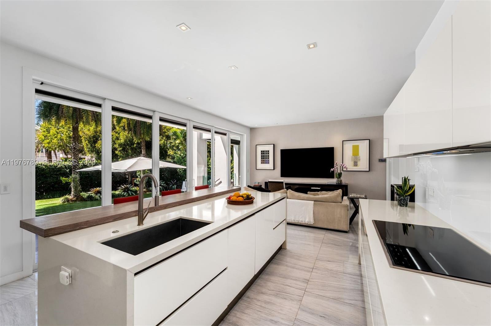 741 Harbor Drive Key Biscayne, FL 33149 - Photo 7 of 36 a living room with furniture and a flat screen tv
