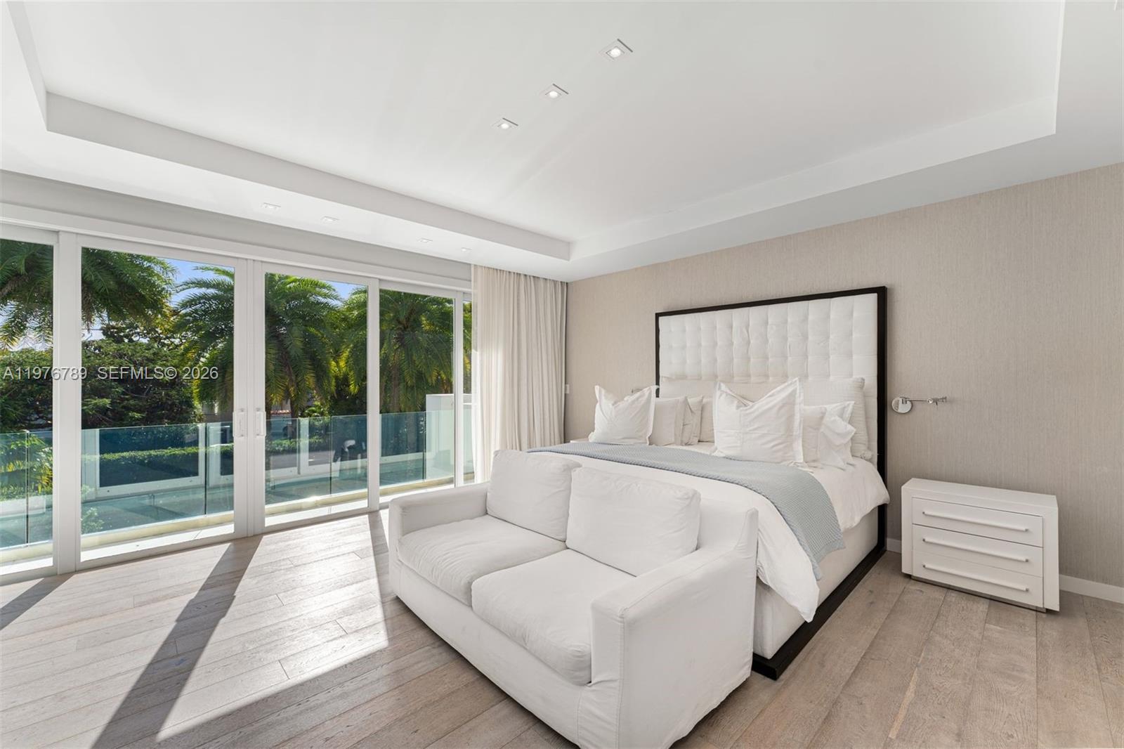 741 Harbor Drive Key Biscayne, FL 33149 - Photo 9 of 36 a spacious bedroom with a bed and a large window