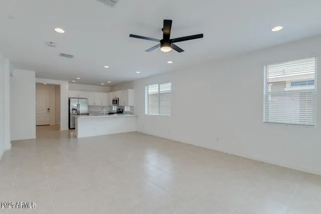 a view of a kitchen with a sink and a window