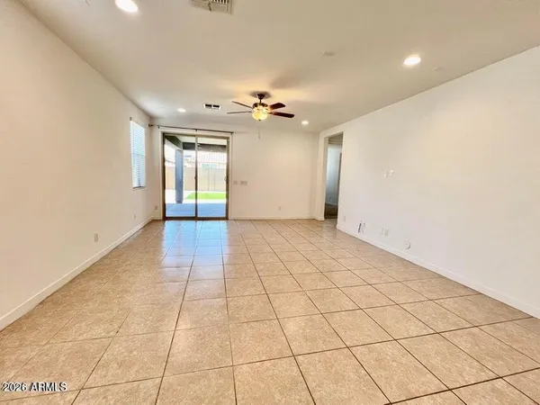 a view of an empty room with glass door