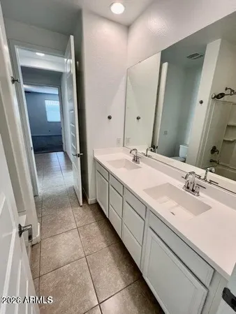 a bathroom with a sink a vanity and a mirror