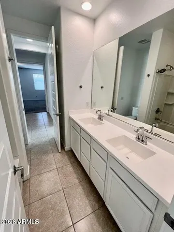 a bathroom with a sink a vanity and a mirror