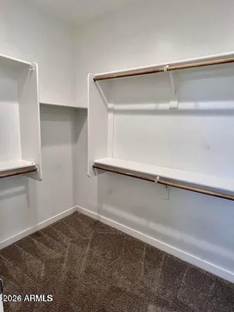 a view of an empty walk in closet