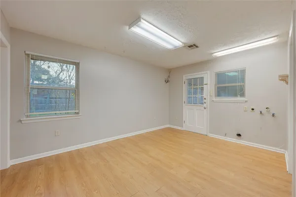 a view of empty room with windows