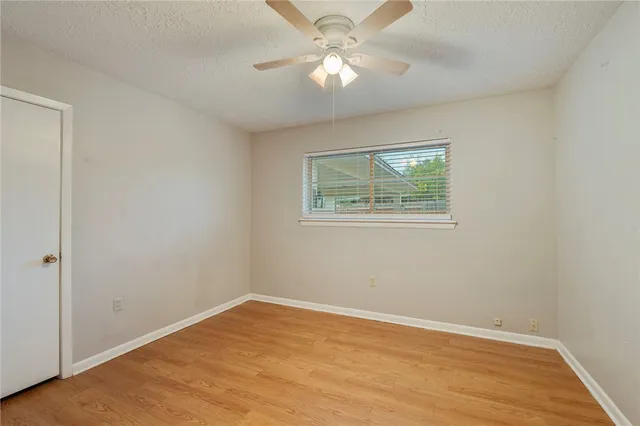 a view of a kitchen with furniture and wooden floor