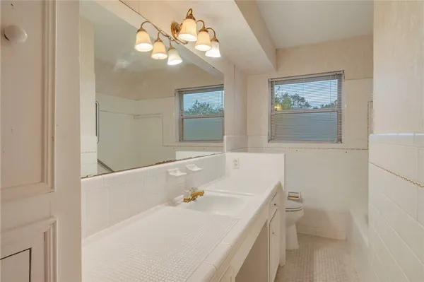 a bathroom with a sink a bathtub and a shower