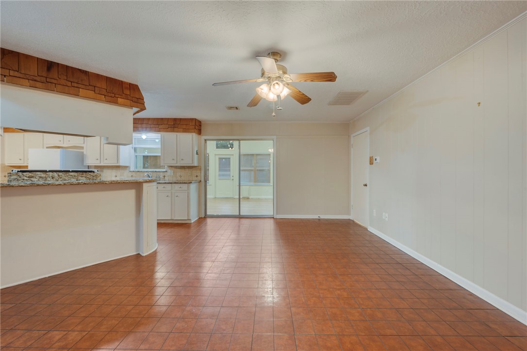 2606 Melba Circle Bryan, TX 77802 - Photo 20 of 34 a view of a kitchen with a sink wooden cabinets and a window