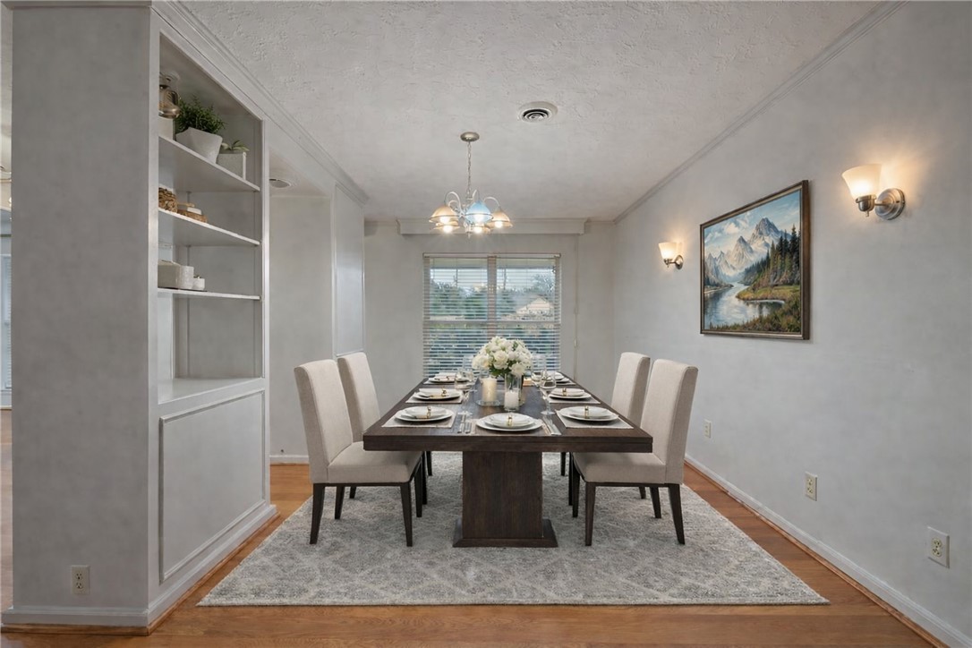 2606 Melba Circle Bryan, TX 77802 - Photo 9 of 34 a view of a dining room with furniture window and wooden floor