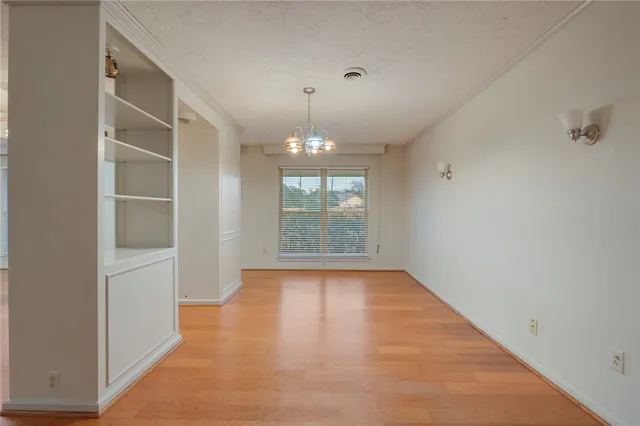 a view of empty room with windows