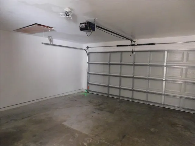 a room with a window and a chair