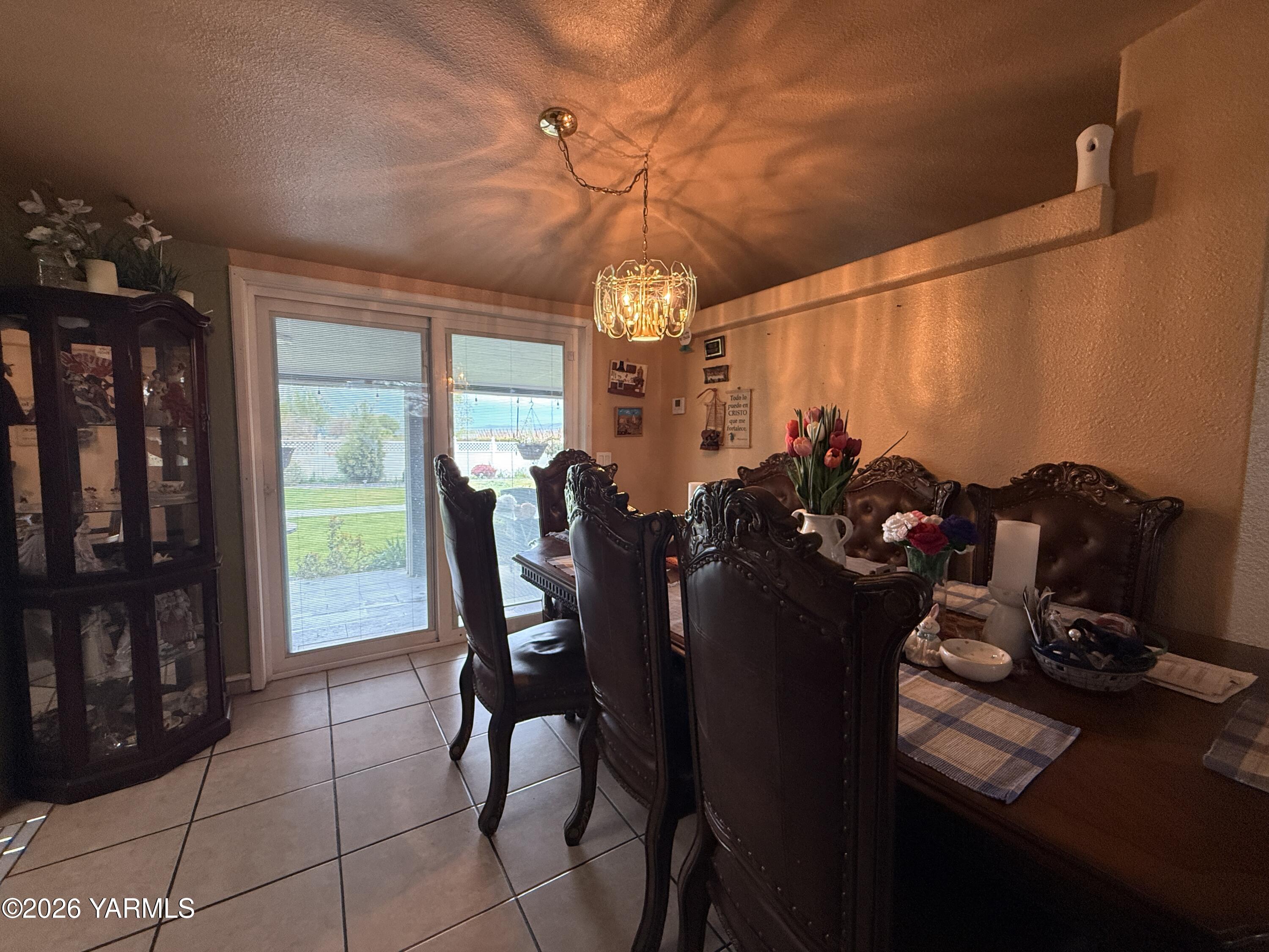 1051 County Line Mabton, WA 98935 - Photo 6 of 22 a view of a dining room with furniture and chandelier
