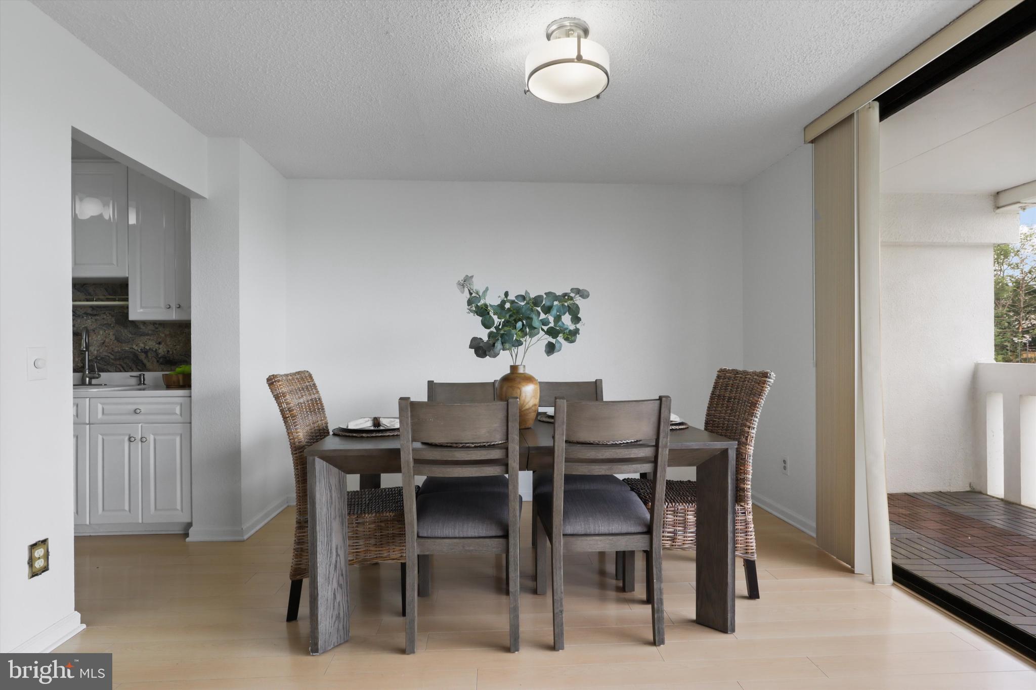 6101 Edsall Road, Unit 611 Alexandria, VA 22304 - Photo 11 of 39 a view of a dining room with furniture and window