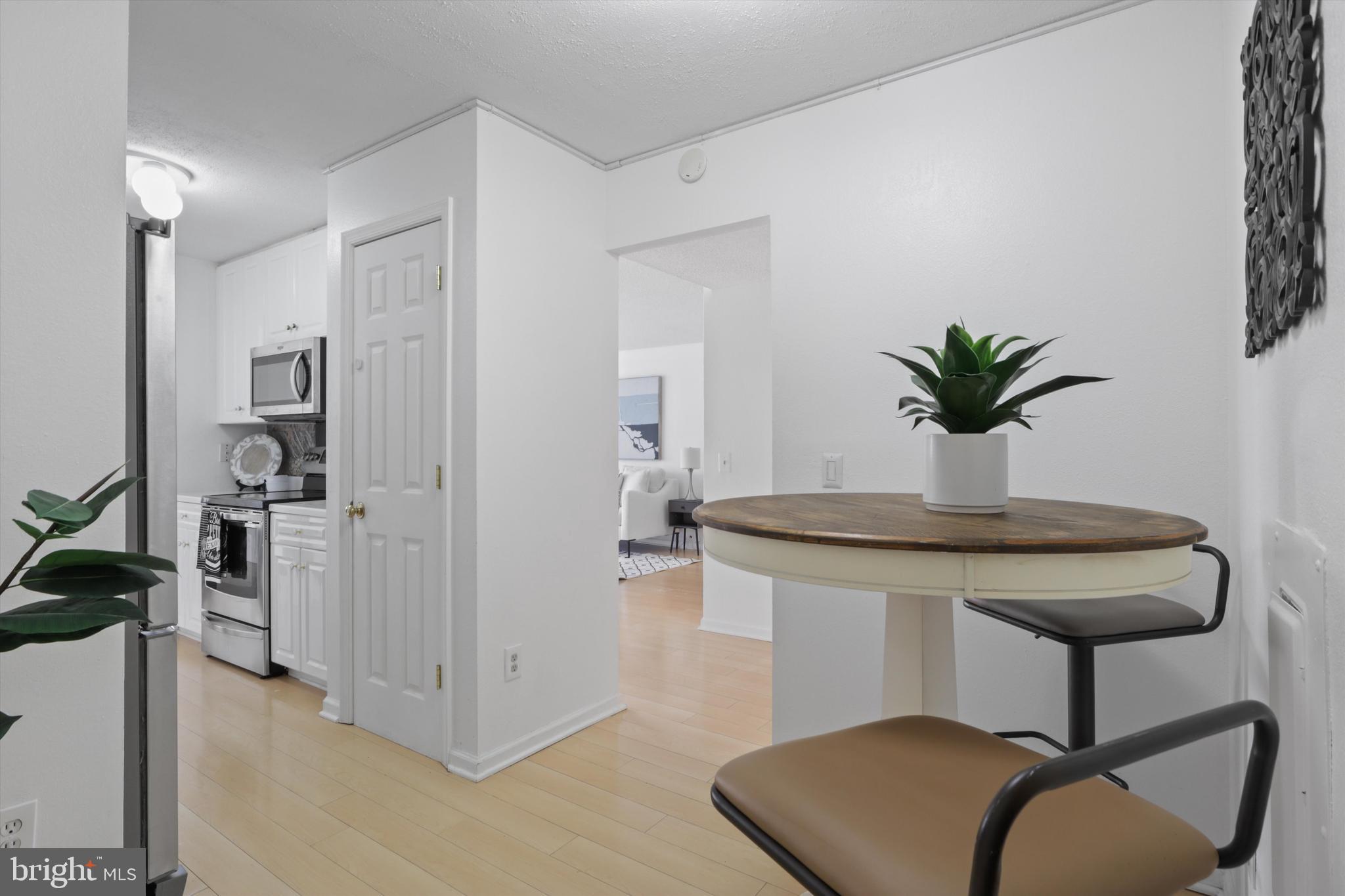 6101 Edsall Road, Unit 611 Alexandria, VA 22304 - Photo 18 of 39 a kitchen with stainless steel appliances a sink and a potted plant