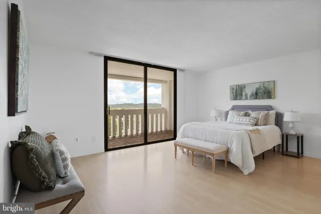 a bedroom with a bed and a couch