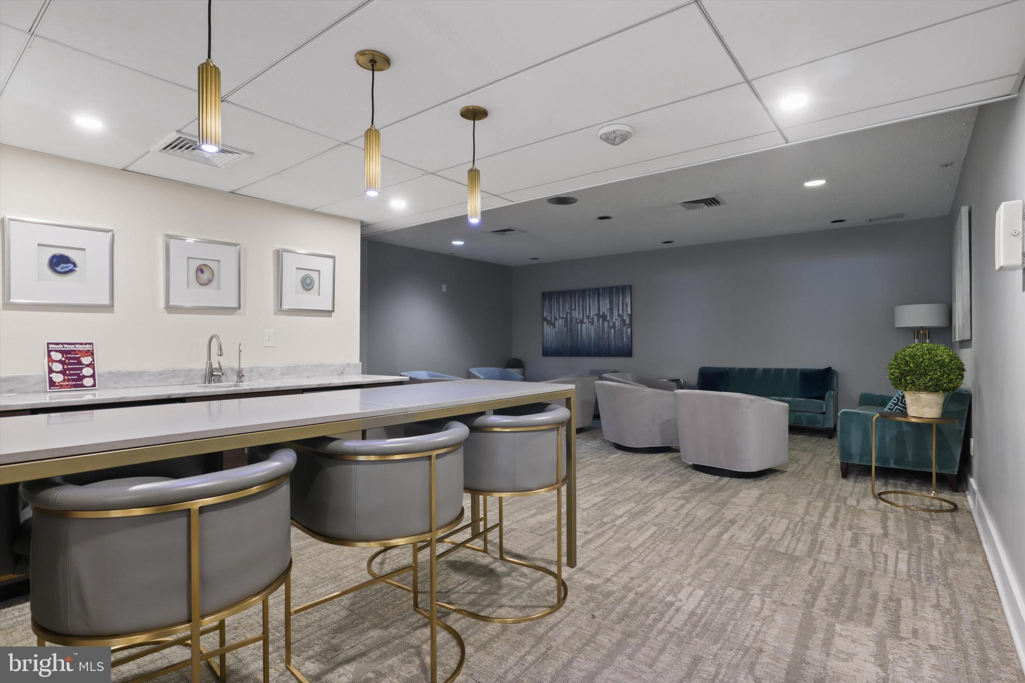 6101 Edsall Road, Unit 611 Alexandria, VA 22304 - Photo 35 of 39 a kitchen with stainless steel appliances granite countertop a sink a stove and a wooden floors