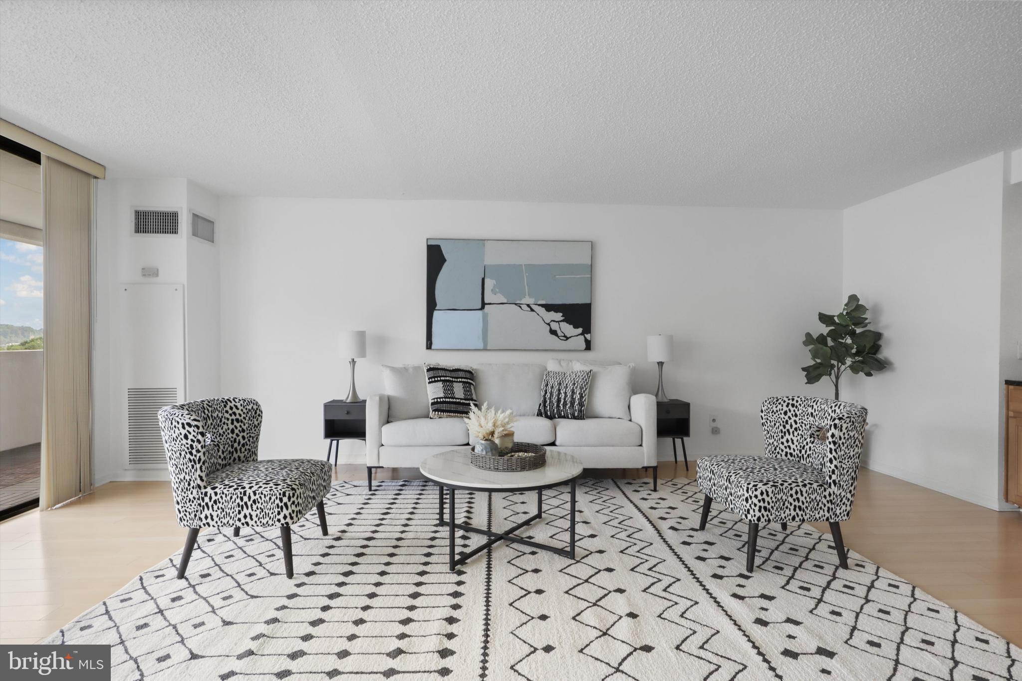 6101 Edsall Road, Unit 611 Alexandria, VA 22304 - Photo 4 of 39 a living room with furniture and wooden floor