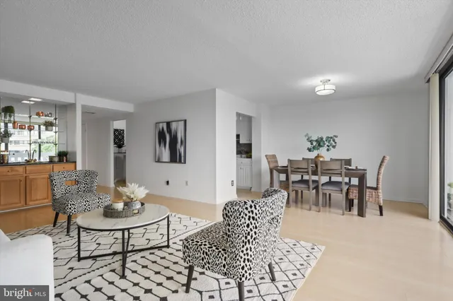 a view of a dining room with furniture and window